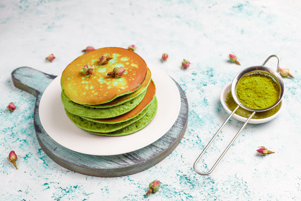 green-pancakes-with-matcha-powder-with-red-jam-light-table